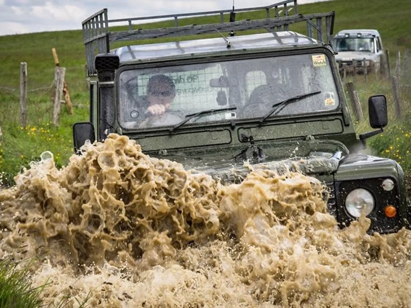 Land Rover Defender crossing the river