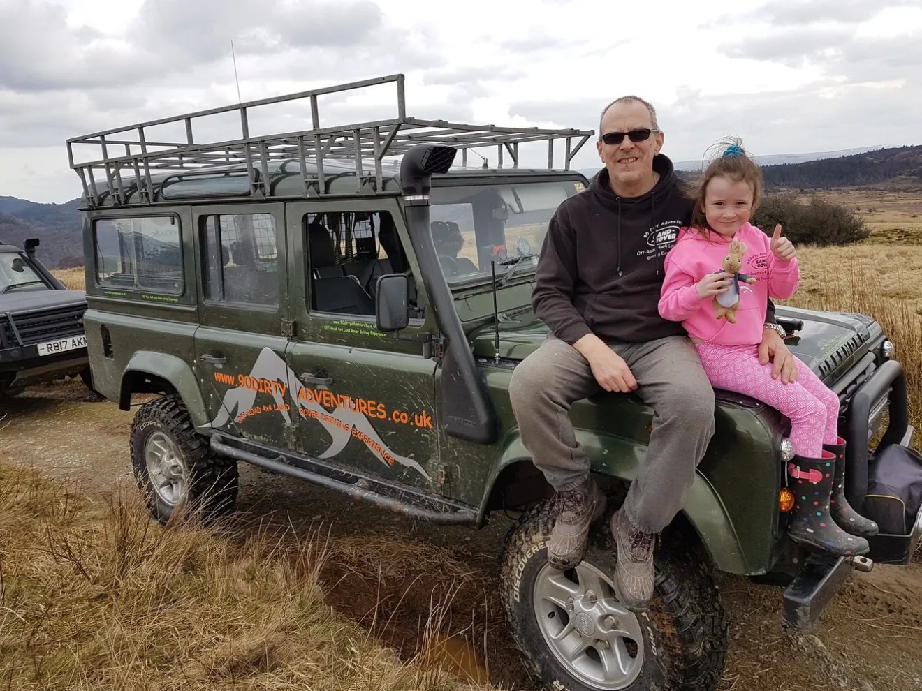 Father and daughter with Land Rover