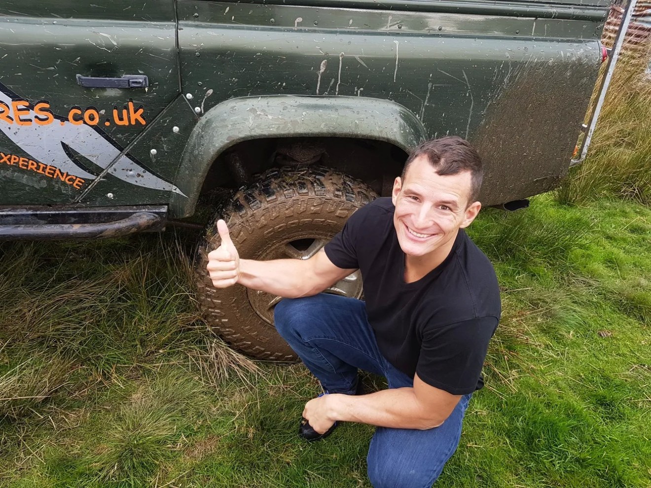 Happy guy and Land Rover Defender
